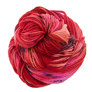 Skein of Madelinetosh TML Triple Twist Worsted weight yarn in color Mars in Retrograde (Red) for knitting and crocheting.