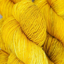 Load image into Gallery viewer, Skein of Madelinetosh Tosh Sock Sock weight yarn in the color Candlewick (Yellow) for knitting and crocheting.
