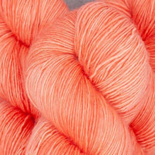 Load image into Gallery viewer, Skein of Madelinetosh Tosh Sock Sock weight yarn in the color Grapefruit (Orange) (orange)  for knitting and crocheting.
