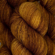 Load image into Gallery viewer, Skein of Madelinetosh Tosh Sock Sock weight yarn in the color Copper Pink Solid (Pink) for knitting and crocheting.
