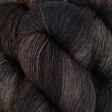 Load image into Gallery viewer, Skein of Madelinetosh Tosh Sock Sock weight yarn in the color Whiskey Barrel (Brown) for knitting and crocheting.
