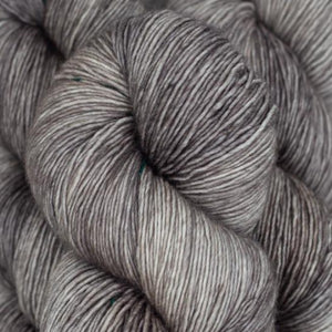 Skein of Madelinetosh Tosh Vintage Worsted weight yarn in the color Kitten (Gray) for knitting and crocheting.