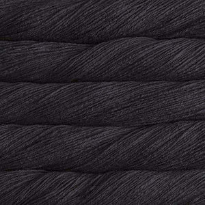 Skein of Malabrigo Arroyo Sport weight yarn in the color Black (Cream) for knitting and crocheting.