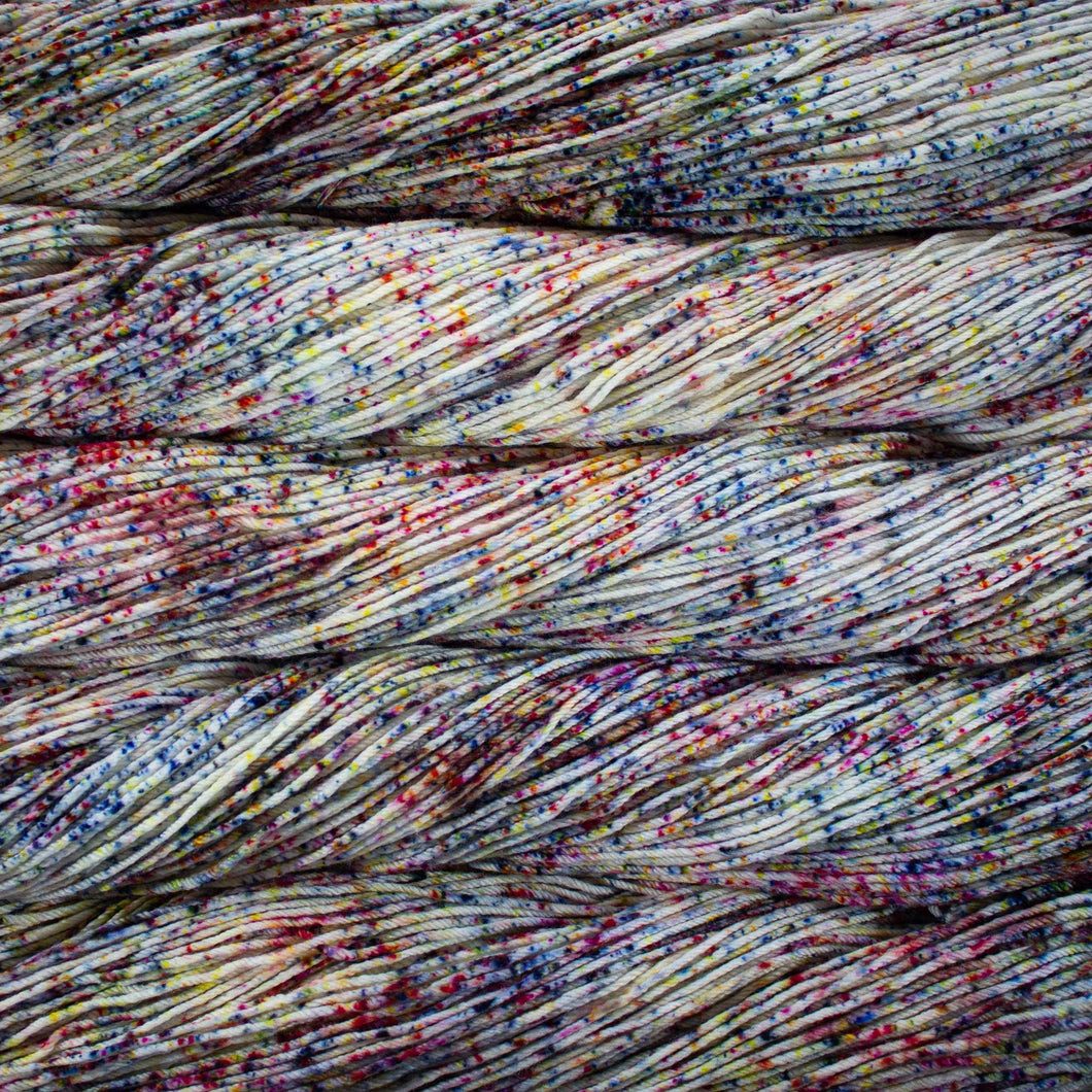 Skein of Malabrigo Arroyo Sport weight yarn in the color Moon Trio Full (Multi) for knitting and crocheting.