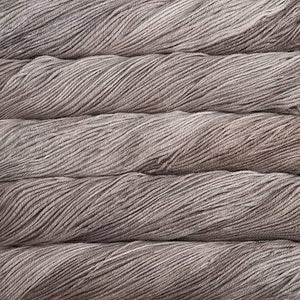 Skein of Malabrigo Arroyo Sport weight yarn in the color Sand Bank (Tan) for knitting and crocheting.