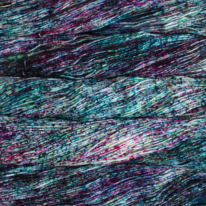 Skein of Malabrigo Arroyo Sport weight yarn in the color Sur (Blue) for knitting and crocheting.