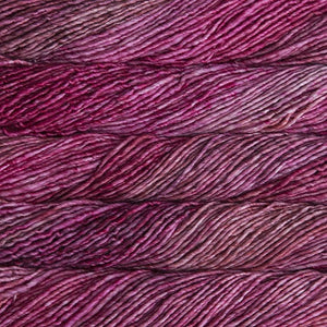 Skein of Malabrigo Mecha Bulky weight yarn in the color English Rose (Pink) for knitting and crocheting.