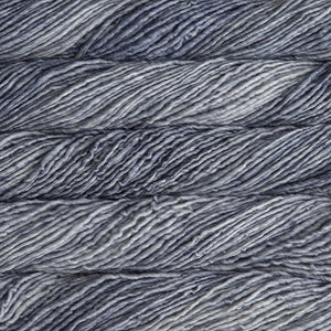 Skein of Malabrigo Mecha Bulky weight yarn in the color Polar Morn (Gray) for knitting and crocheting.