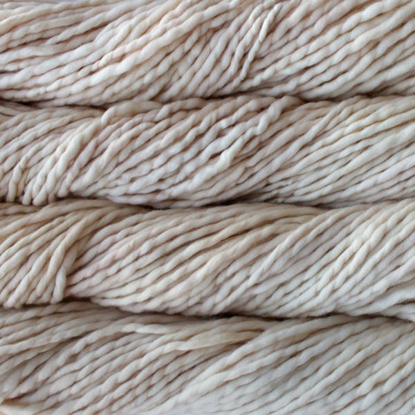 Skein of Malabrigo Rasta Super Bulky weight yarn in the color Ivory (Cream) for knitting and crocheting.