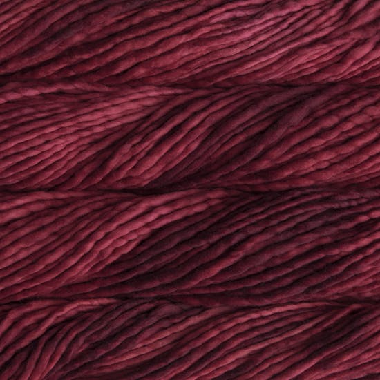 Skein of Malabrigo Rasta Super Bulky weight yarn in the color Ravelry Red (Red) for knitting and crocheting.