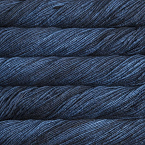 Skein of Malabrigo Rios Worsted weight yarn in the color Azul Profundo (Blue) for knitting and crocheting.