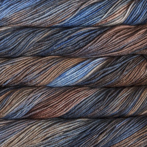 Skein of Malabrigo Rios Worsted weight yarn in the color Cielo y Tierra (Blue) for knitting and crocheting.