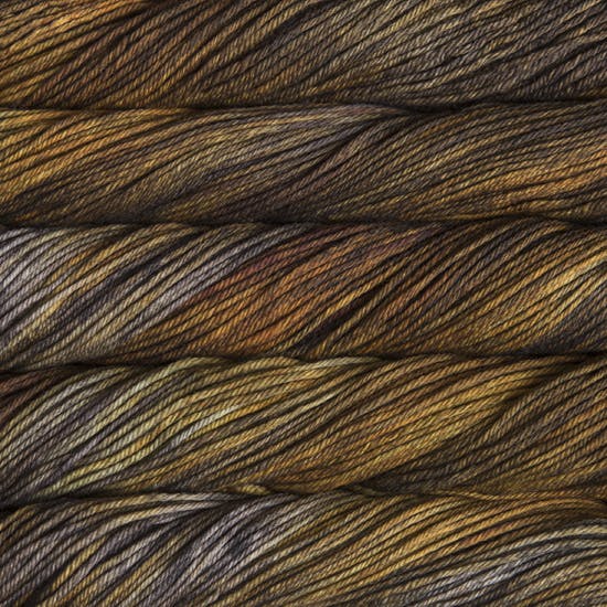 Skein of Malabrigo Rios Worsted weight yarn in the color Glitter (Brown) for knitting and crocheting.