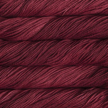 Load image into Gallery viewer, Skein of Malabrigo Rios Worsted weight yarn in the color Ravelry Red (Pink) for knitting and crocheting.
