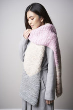 Load image into Gallery viewer, A scarf is shown in light pink, cream and gray.
