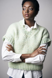 Haven, a short-sleeve, v-neck pullover is shown in a light green color.