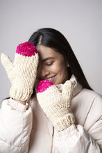 Load image into Gallery viewer, White mittens with a pink tip are shown, made from the Peyton knitting pattern.
