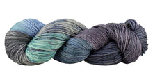 Load image into Gallery viewer, Skein of Manos del Uruguay Feliz Space-Dyed DK weight yarn in the color Provence (Gray) for knitting and crocheting.
