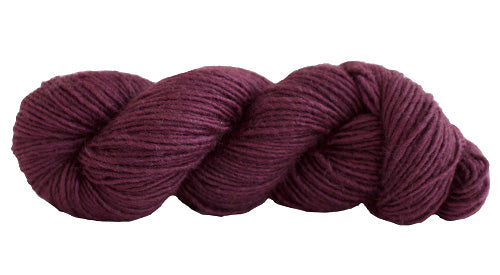 Skein of Manos del Uruguay Silk Blend DK weight yarn in the color Bing Cherry (Purple) for knitting and crocheting.
