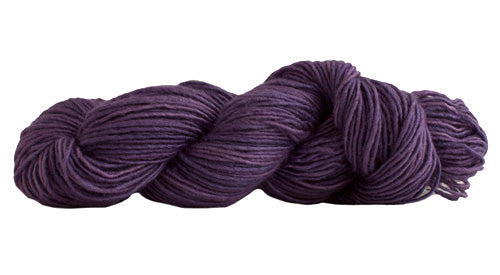 Skein of Manos del Uruguay Silk Blend DK weight yarn in the color Countess Violet (Purple) for knitting and crocheting.