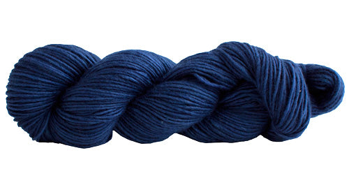 Skein of Manos del Uruguay Silk Blend DK weight yarn in the color Dark Wash (Blue) for knitting and crocheting.