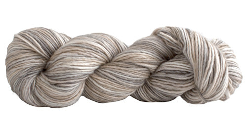 Skein of Manos del Uruguay Silk Blend Space-Dyed DK weight yarn in the color Desert (Tan) for knitting and crocheting.