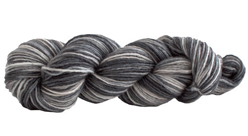 Skein of Manos del Uruguay Silk Blend Space-Dyed DK weight yarn in the color Zebra (Gray) for knitting and crocheting.