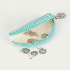 A zippered clamshell case containing several sterling silver stitch markers is shown.