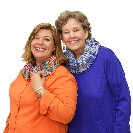 Jenny Fish and Jenny Doan model the One Big Happy Yarn Co Cowl in colors Park (multi) and Coast (blue multi).