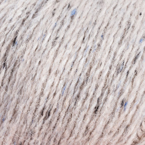 Skein of Rowan Felted Tweed DK DK weight yarn in the color Clay (Cream) for knitting and crocheting.
