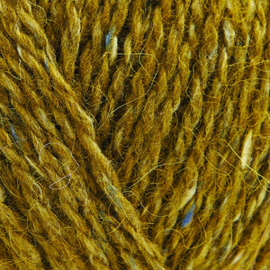 Skein of Rowan Felted Tweed DK DK weight yarn in the color French Mustard (Yellow) for knitting and crocheting.