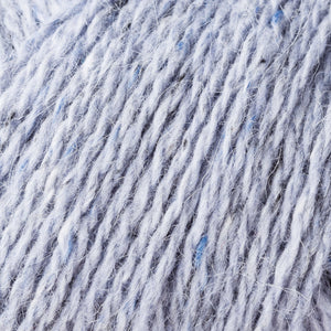Skein of Rowan Felted Tweed DK DK weight yarn in the color Scree (Blue) for knitting and crocheting.