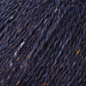 Skein of Rowan Felted Tweed DK DK weight yarn in the color Seafarer (Blue) for knitting and crocheting.