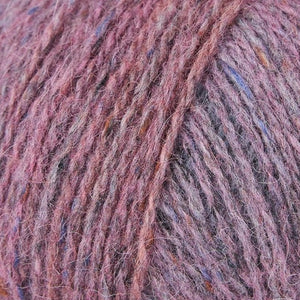 Skein of Rowan Felted Tweed Color DK weight yarn in color Blush (Pink) for knitting and crocheting.