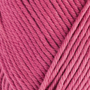 Skein of Rowan Handknit Cotton DK weight yarn in the color Raspberry (Pink) for knitting and crocheting.