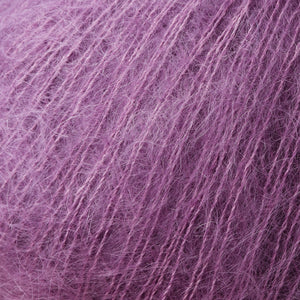 Skein of Rowan Kidsilk Haze Lace weight yarn in the color Dewberry (Purple) for knitting and crocheting.