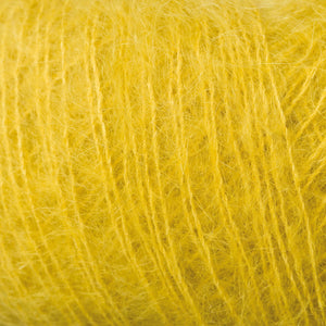 Skein of Rowan Kidsilk Haze Lace weight yarn in the color Eve Green (Yellow) for knitting and crocheting.