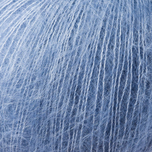 Skein of Rowan Kidsilk Haze Lace weight yarn in the color Heavenly (Blue) for knitting and crocheting.