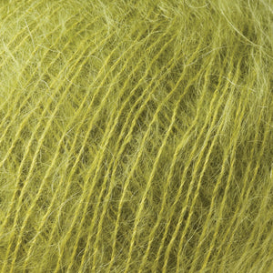 Skein of Rowan Kidsilk Haze Lace weight yarn in the color Jelly (Green) for knitting and crocheting.