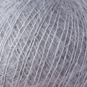 Skein of Rowan Kidsilk Haze Lace weight yarn in the color Steel (Gray) for knitting and crocheting.