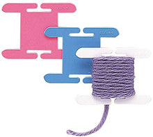 Load image into Gallery viewer, 3 Clover brand knitting bobbins with yarn.

